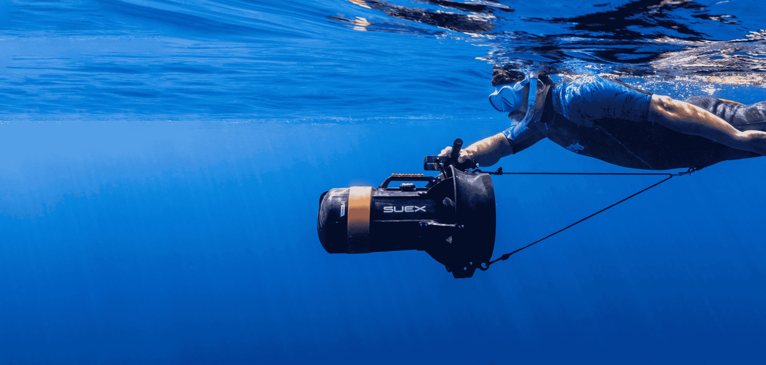 Snorkeller at the surface towed by the NEMO DPV